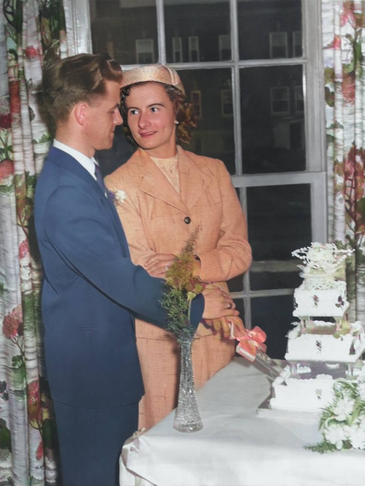 An edited and restored photo of my Grandma and Grandpa (mom's side) cutting their wedding cake.